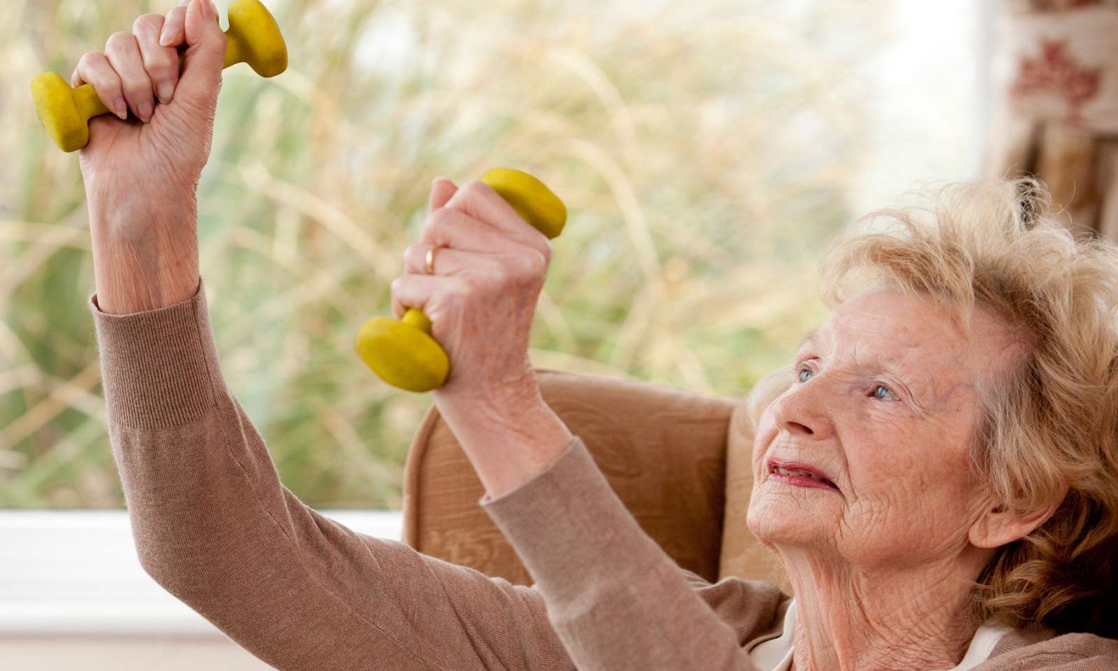 Ageing Well - elder woman doing exercise