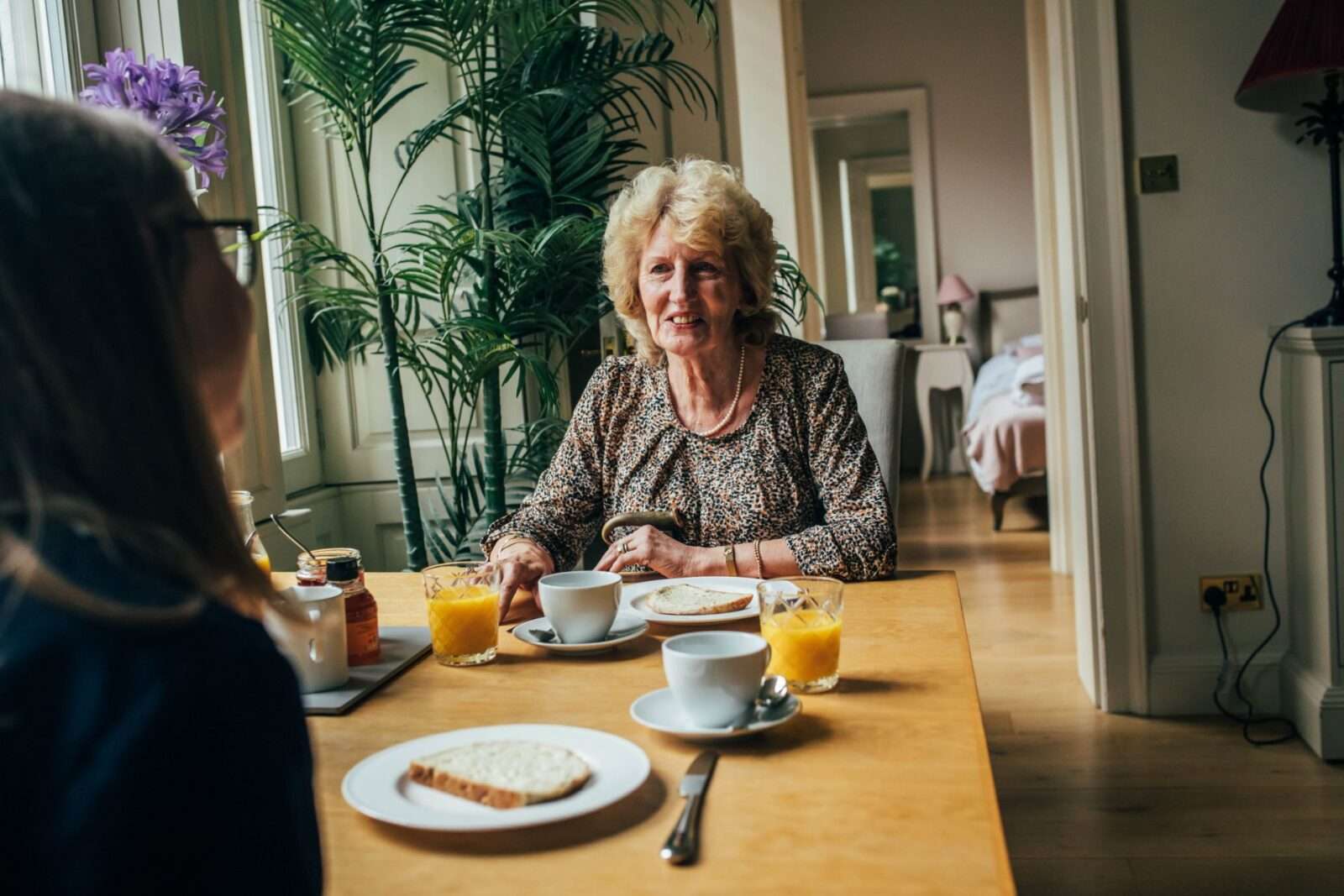 Bright Carer and her client having breakfast