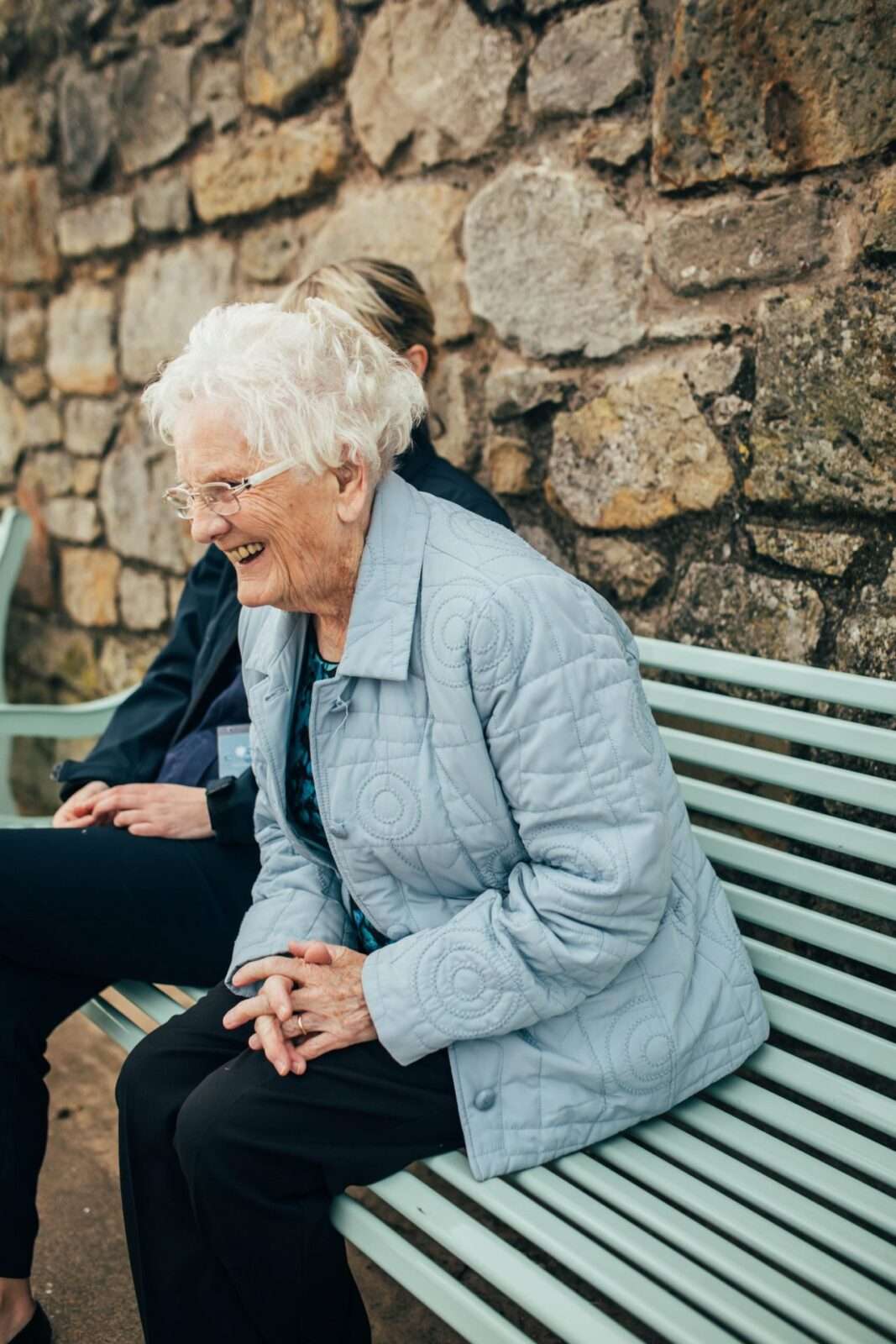 Bright Care's client laughs while talking to her Bright Carer
