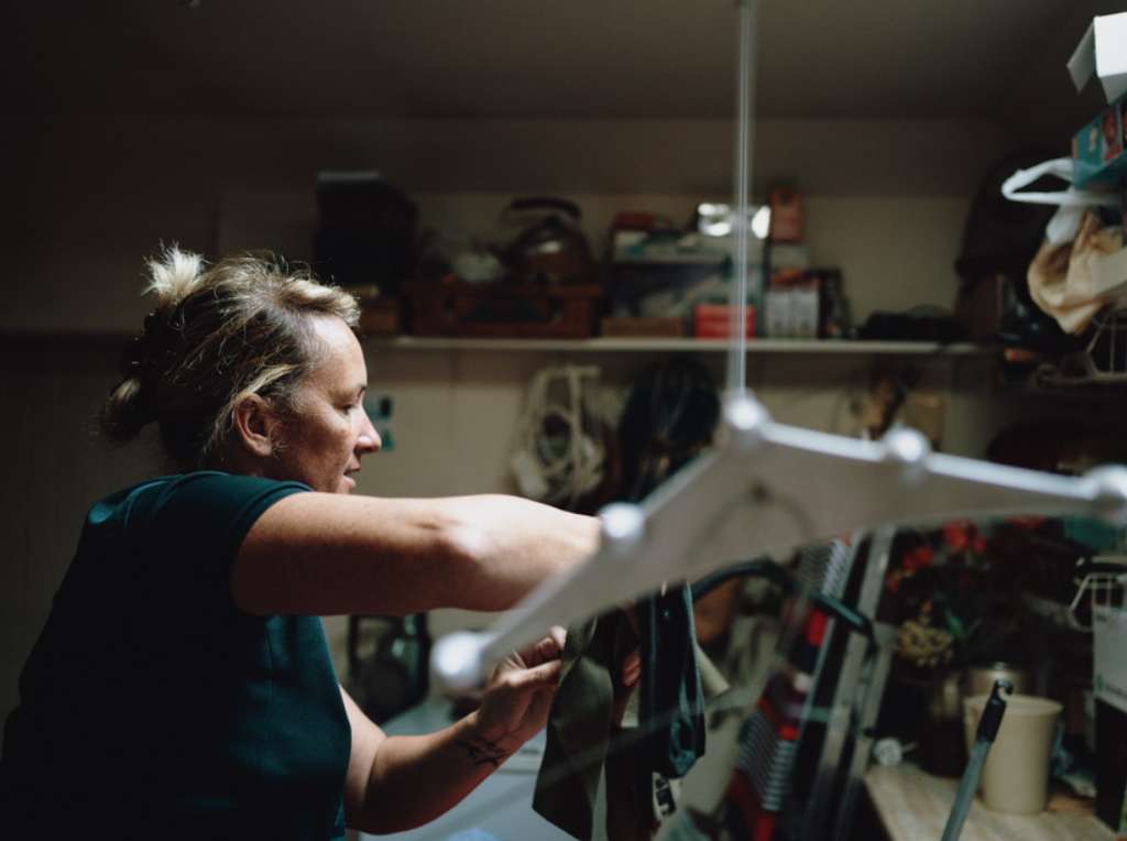 One of our Bright Care carers sorting some household chores for one of our elderly clients.