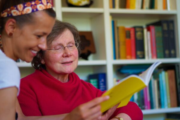 frances and carer reading