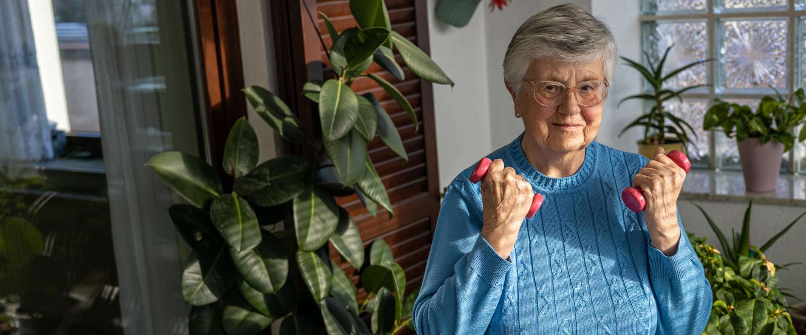 Elder woman working out at home