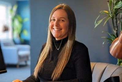 Laura, Care Manager sitting at her desk