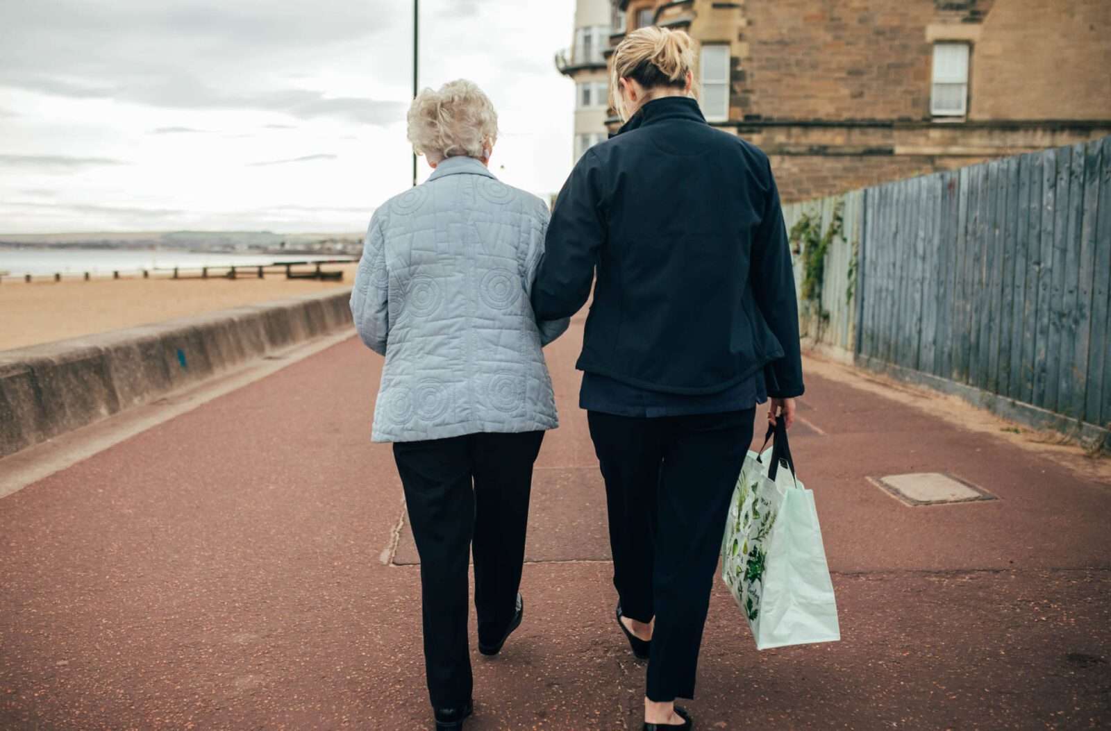Client and carer walking - care company