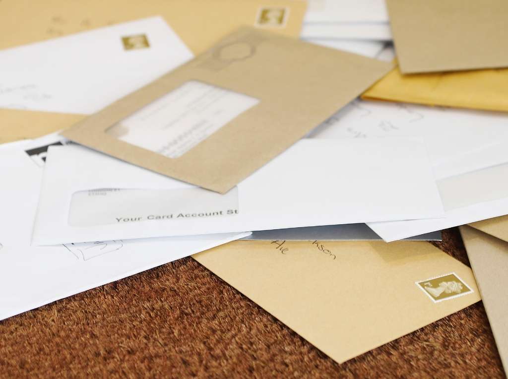 A photo of some unopened letters.
